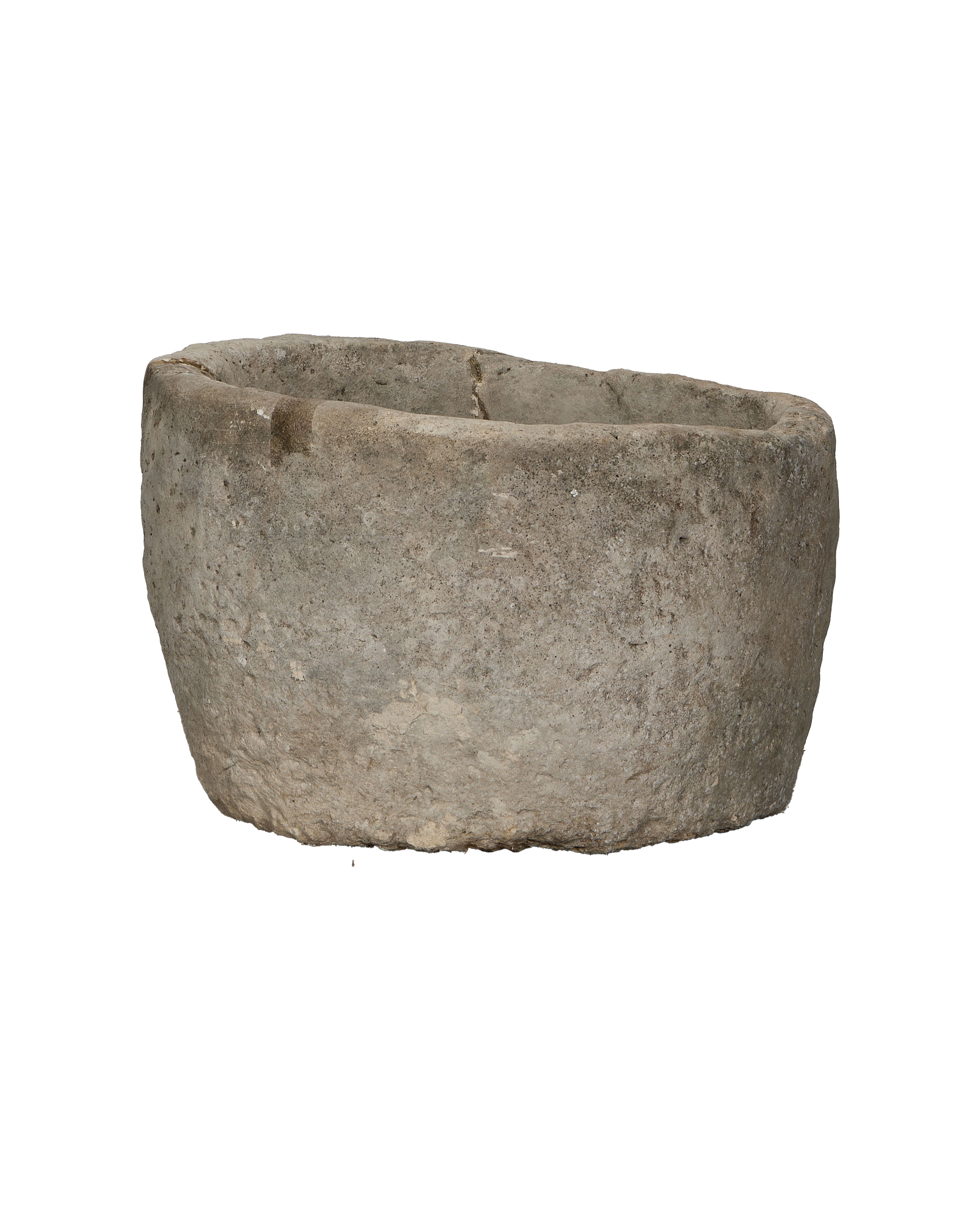 Vintage limestone trough from Indonesia, showing rough, weathered texture and chipped rim.