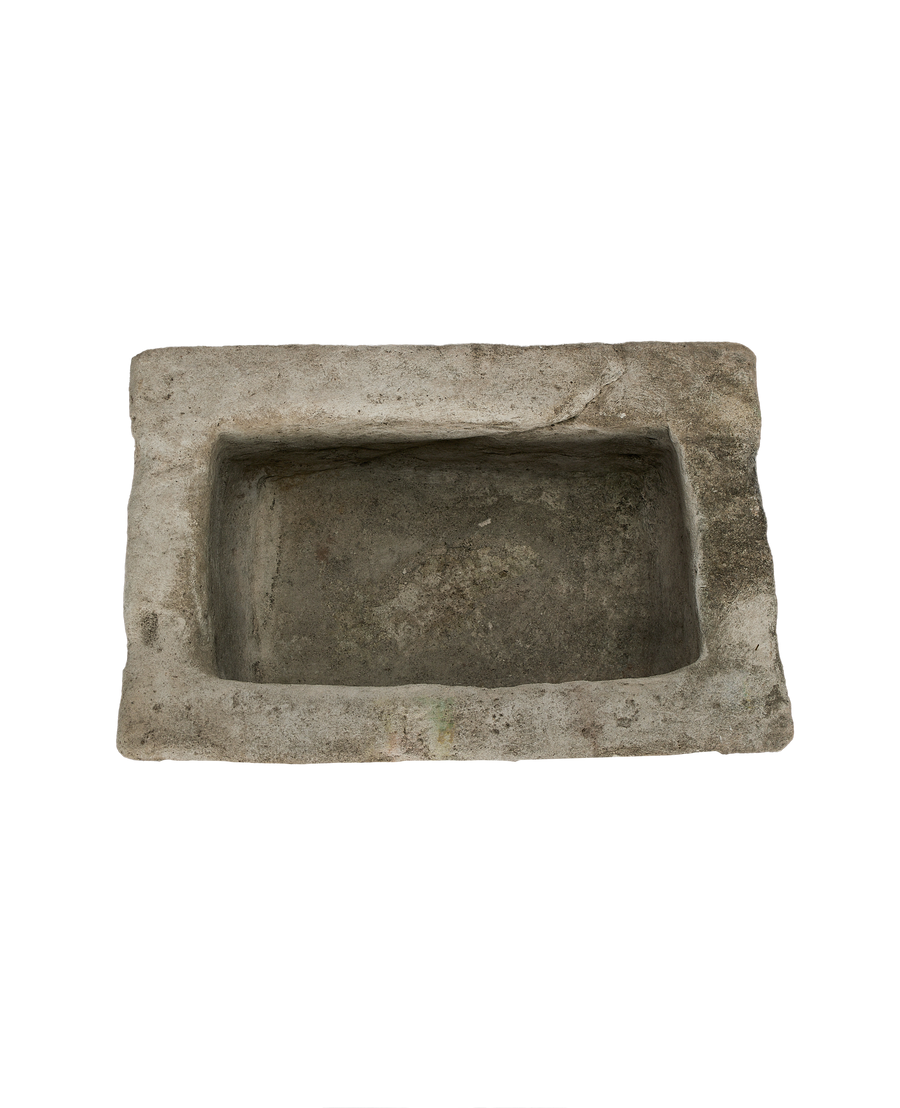 Vintage rectangular Indonesian limestone trough, top-down view showing interior depth and rough texture.