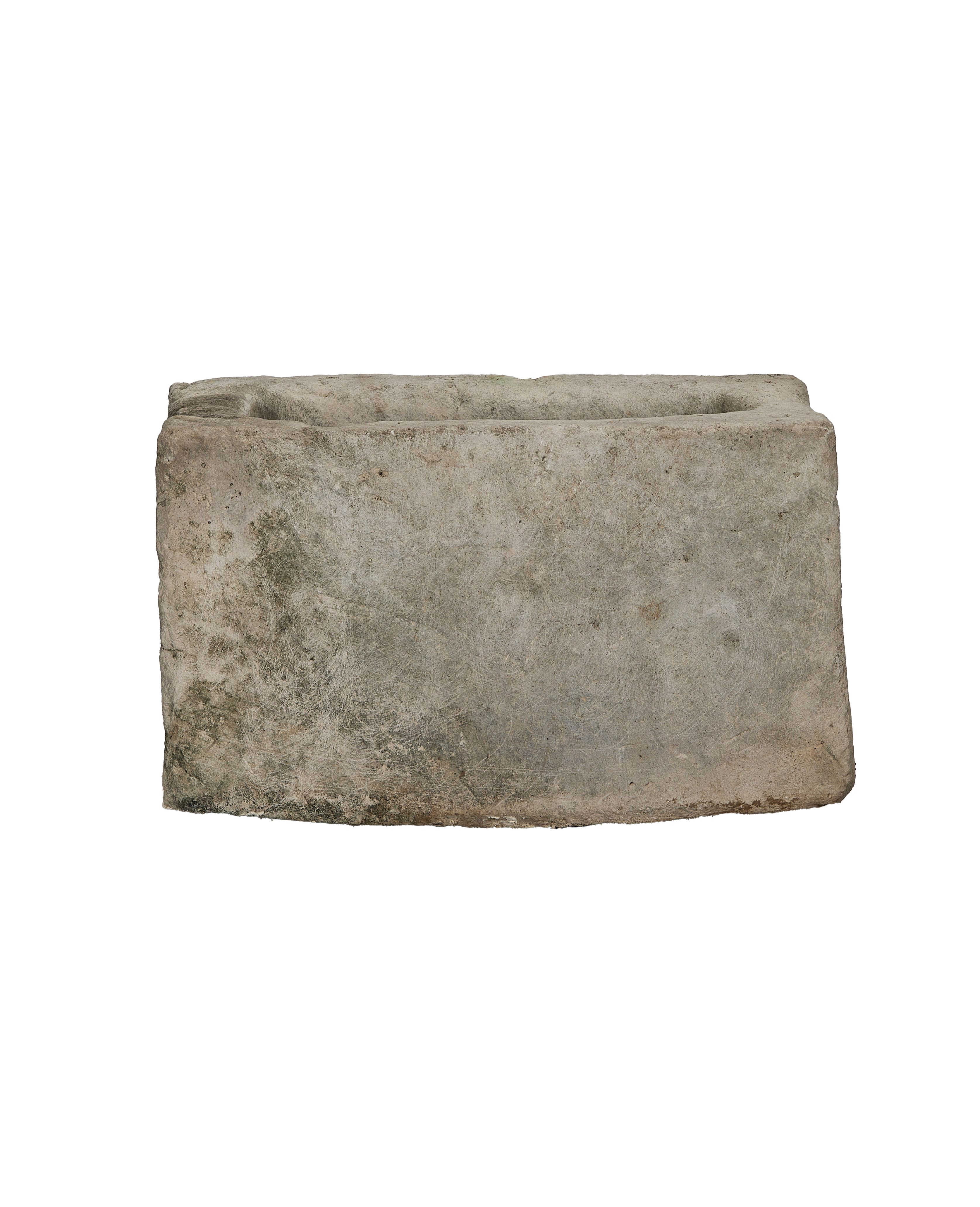 Vintage rectangular limestone trough, showing weathered texture with green moss and rough edges.