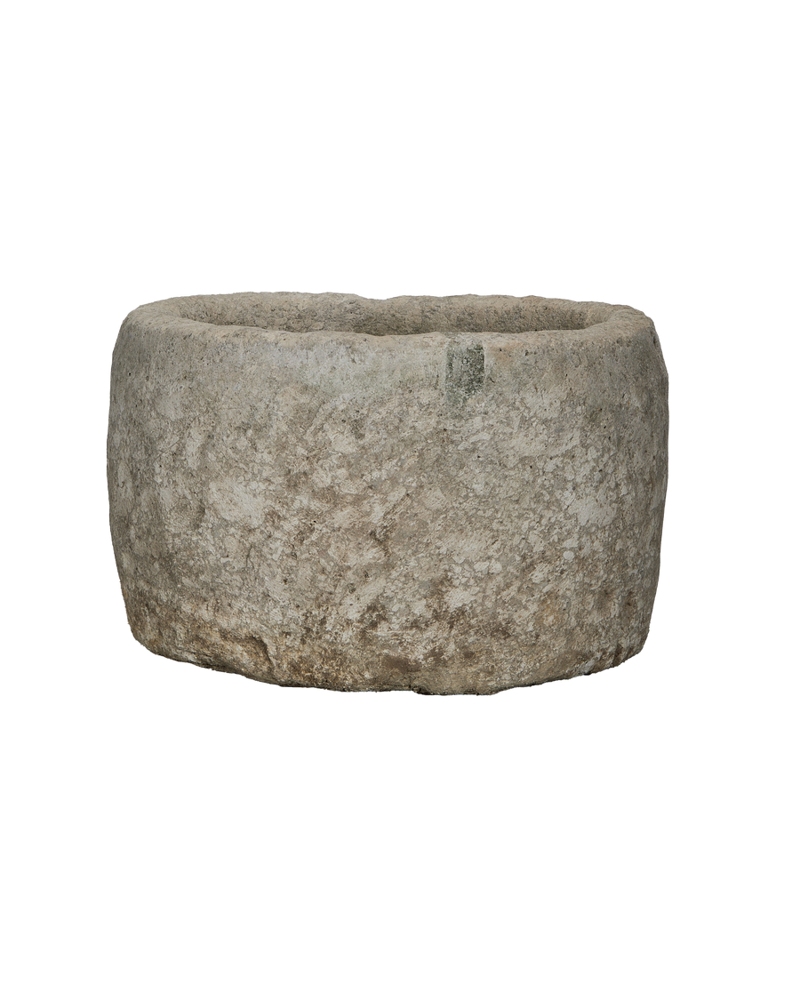 Vintage Indonesian round limestone trough, showing weathered texture from natural aging.