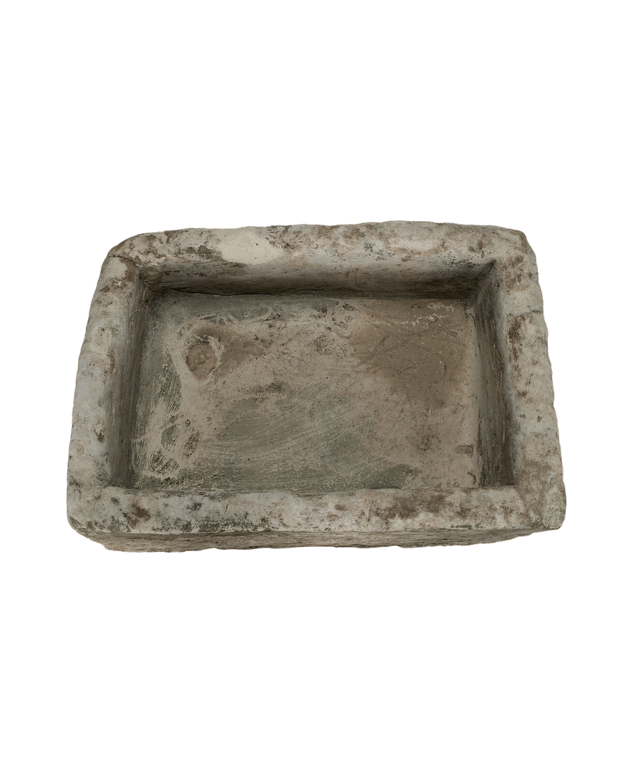 Vintage Indonesian limestone trough, top view with visible weathered texture and rough edges.