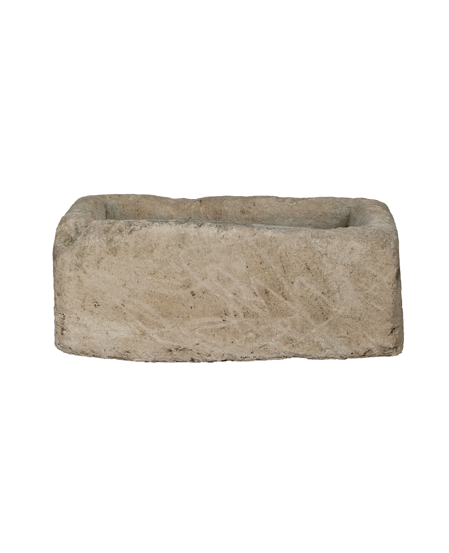 Vintage Indonesian rectangular limestone trough showing aged texture on its side.