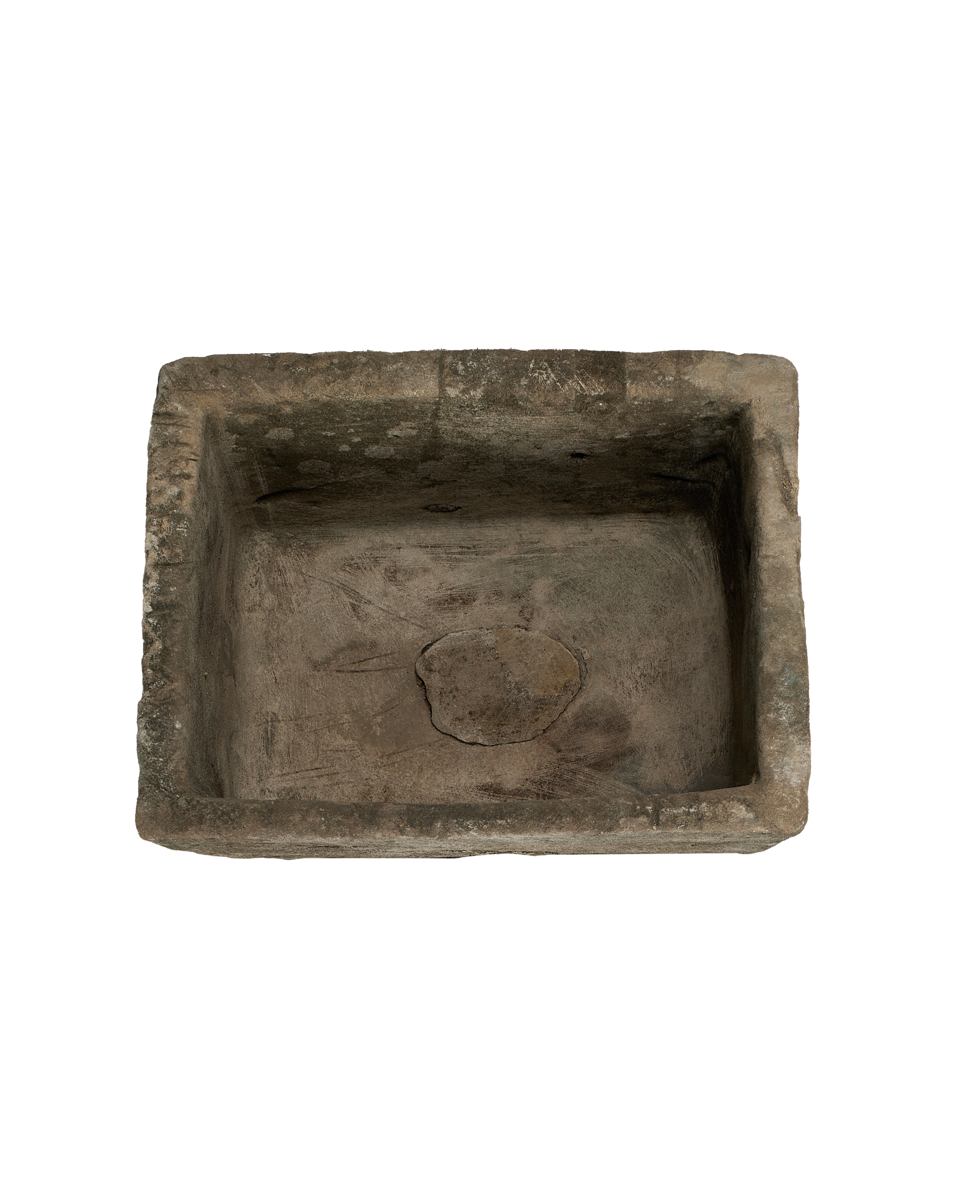 Vintage limestone trough from above, showing rectangular shape and weathered interior texture.