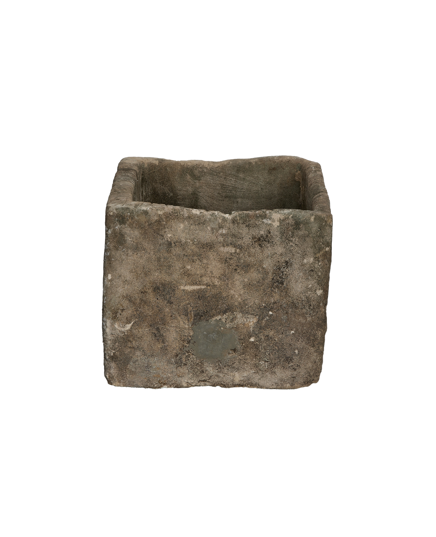 Rectangular vintage Indonesian limestone trough, showcasing textured weathered sides with a mottled gray-brown patina.
