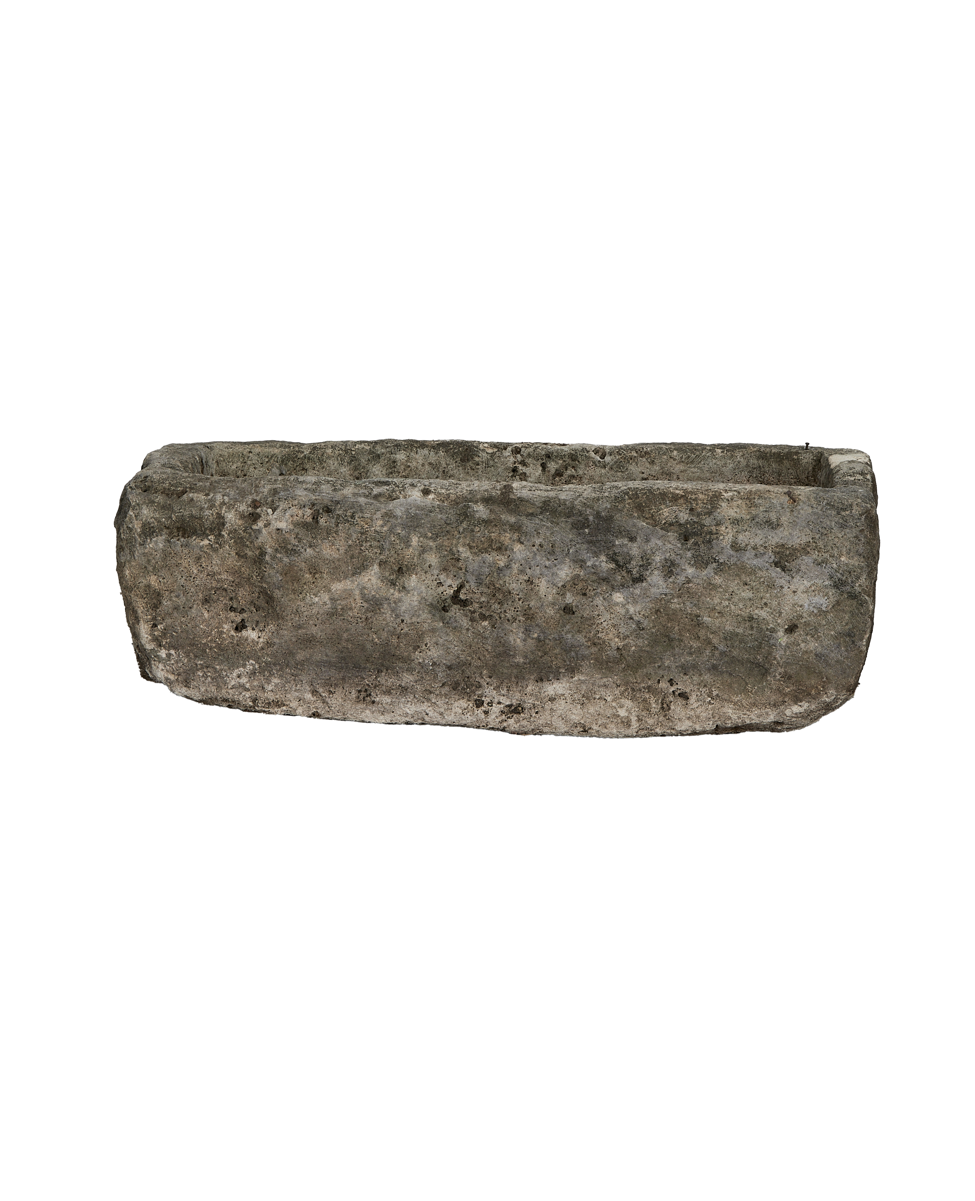 Vintage limestone trough from Indonesia, weathered surface, rectangular shape, side view.