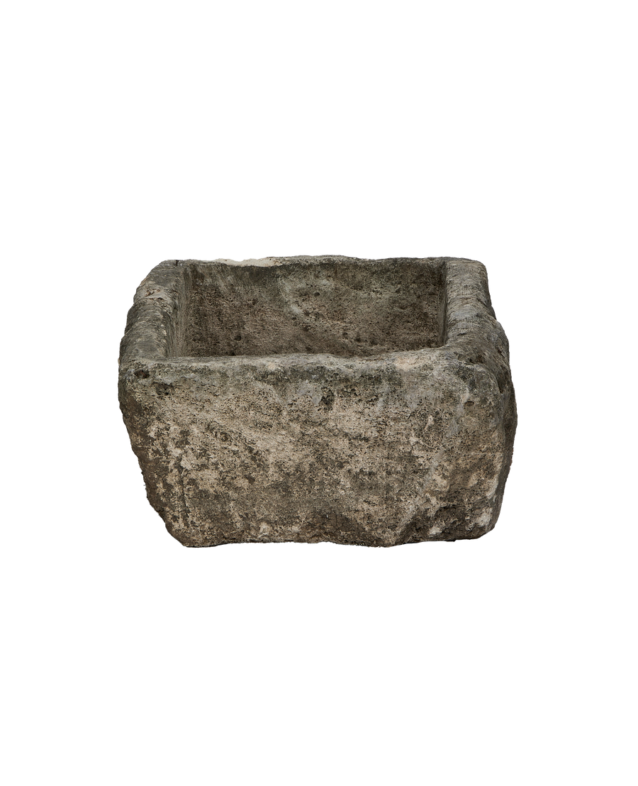 Vintage Indonesian limestone rectangular trough, showing rough exterior texture and weathered surfaces.