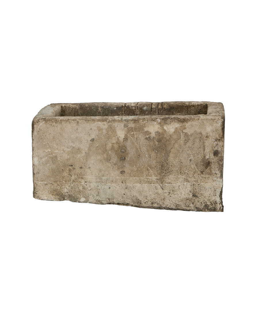 Vintage Indonesian limestone trough, rectangular, highlighting textured surface from front angle view.