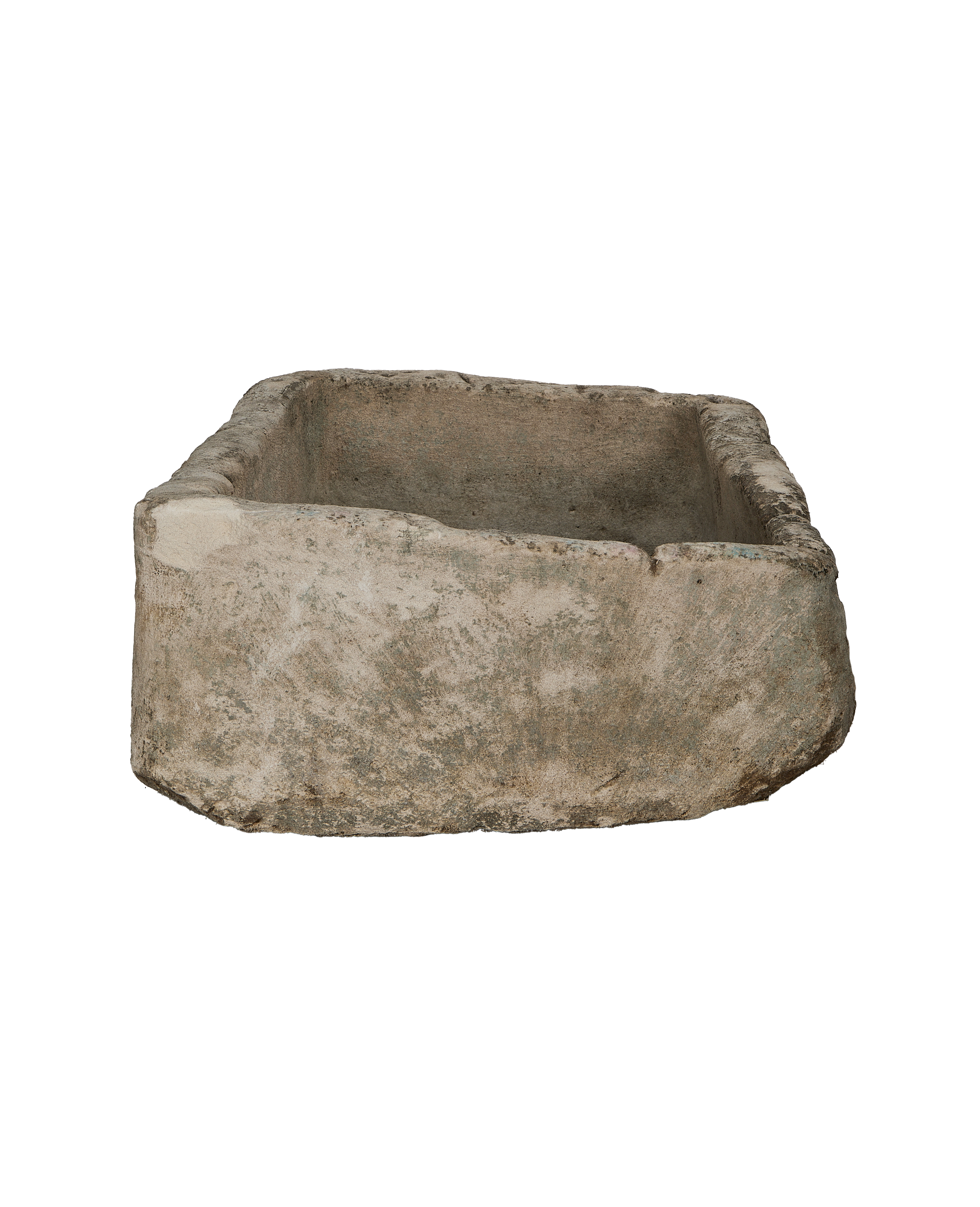 Vintage Indonesian rectangular limestone trough, showcasing weathered texture and raw edges from a side angle.