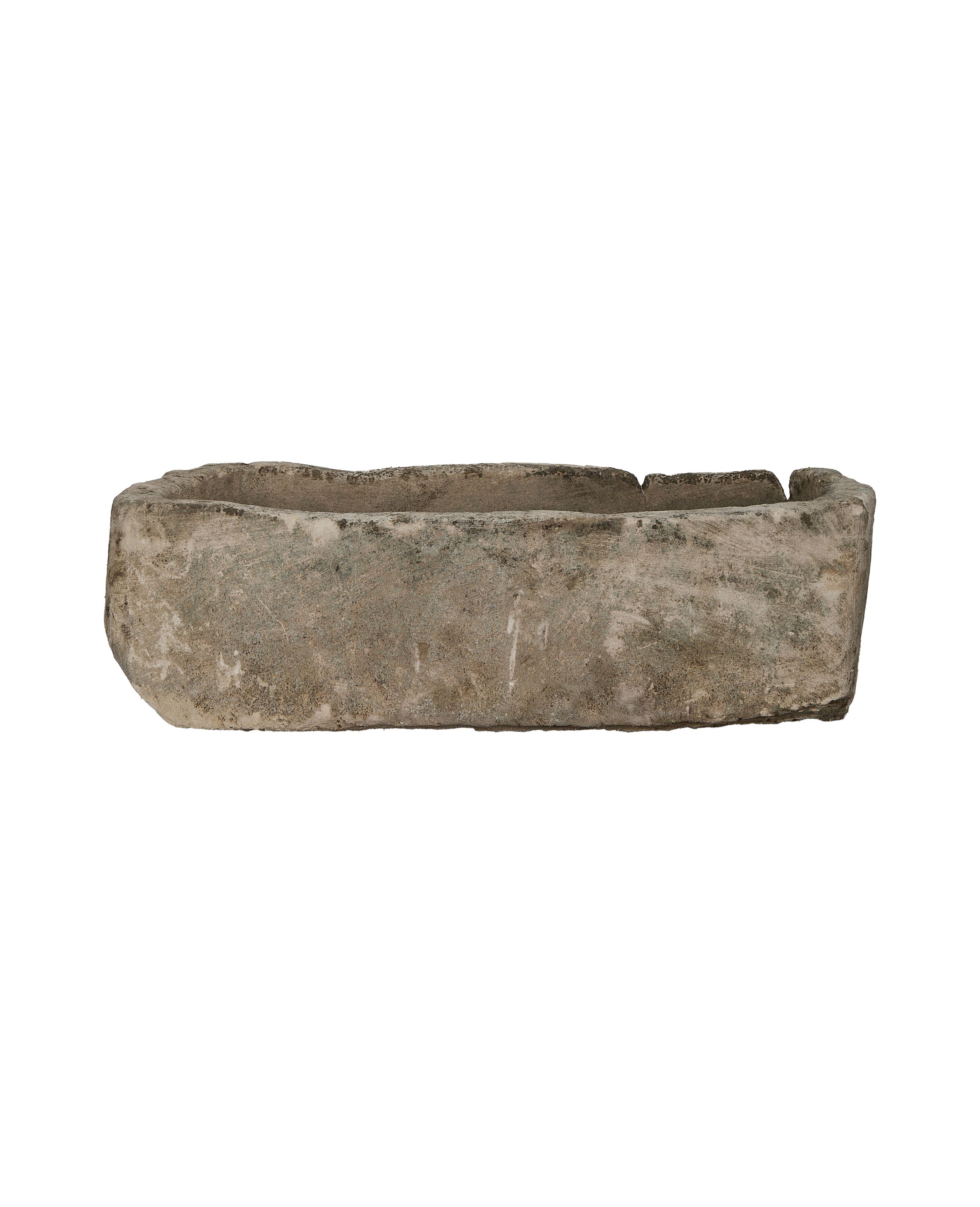 Vintage Indonesian limestone trough, rectangular, rough-hewn texture, and worn condition, side view.