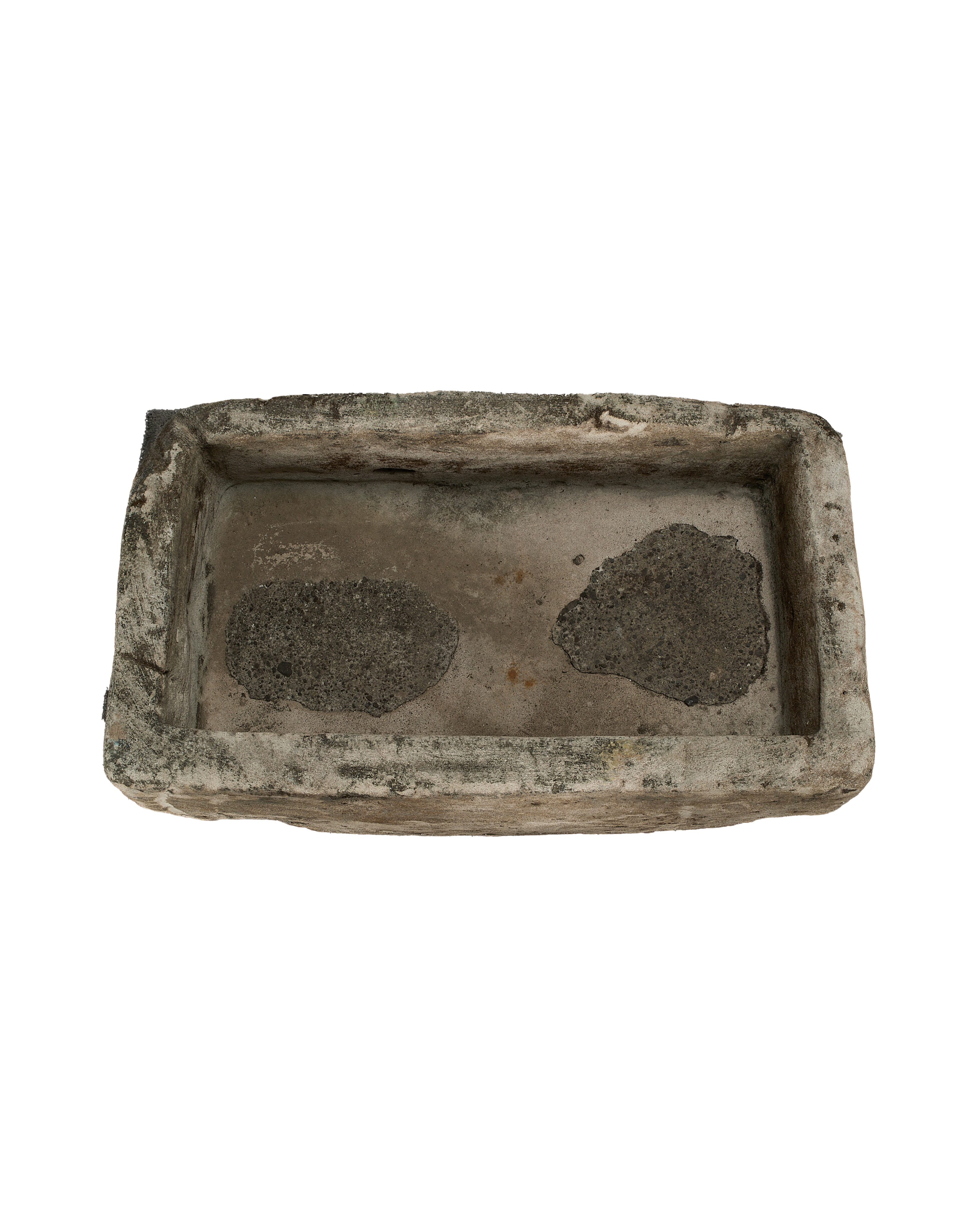 Vintage Indonesian limestone trough, top view, showing textured interior and rough-hewn rectangular edges.