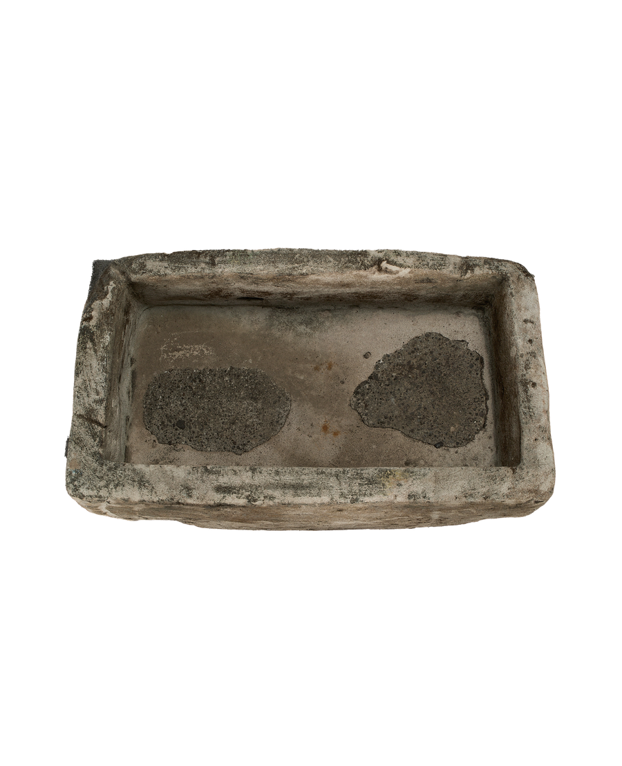Vintage Indonesian limestone trough, top view, showing textured interior and rough-hewn rectangular edges.