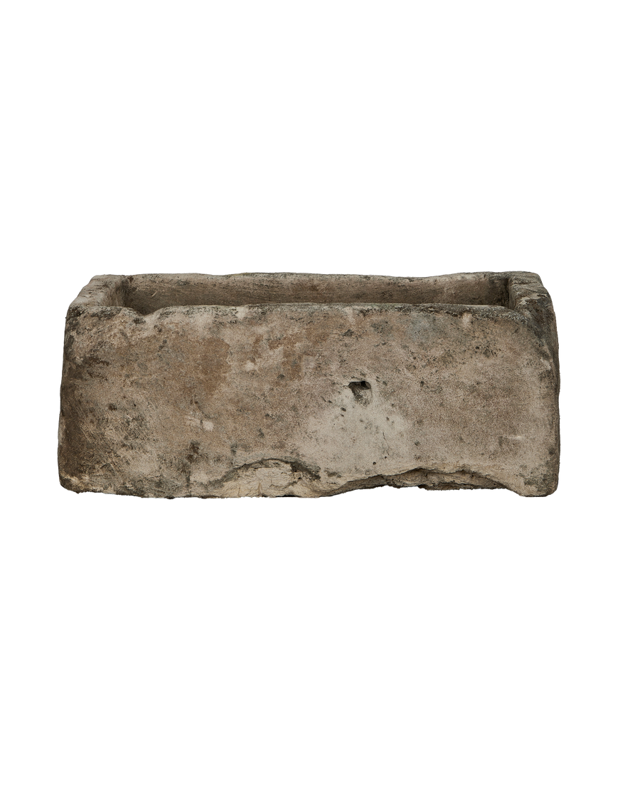 Vintage Indonesian limestone rectangular trough, weathered exterior with rough edges and central indent.
