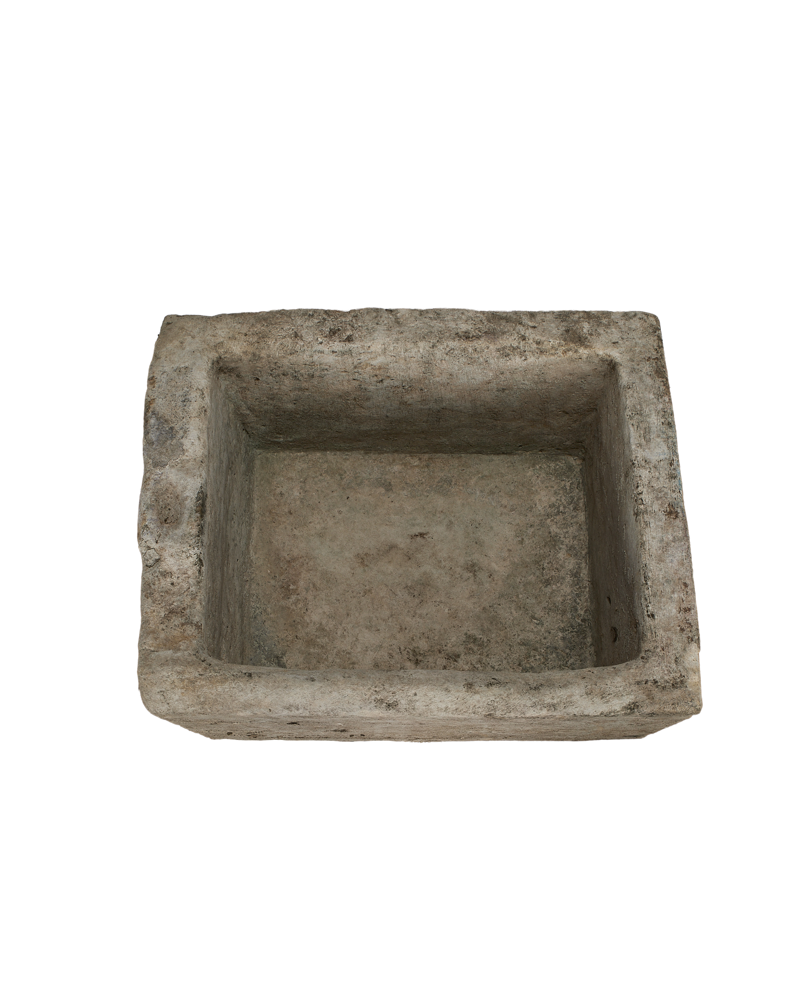 Vintage rectangular limestone trough, showing the weathered texture inside with rough, uneven edges.