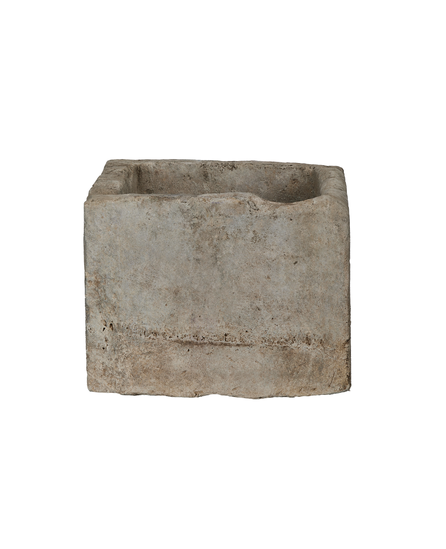 Vintage Indonesian limestone rectangular trough, side view revealing rustic texture and deep basin.