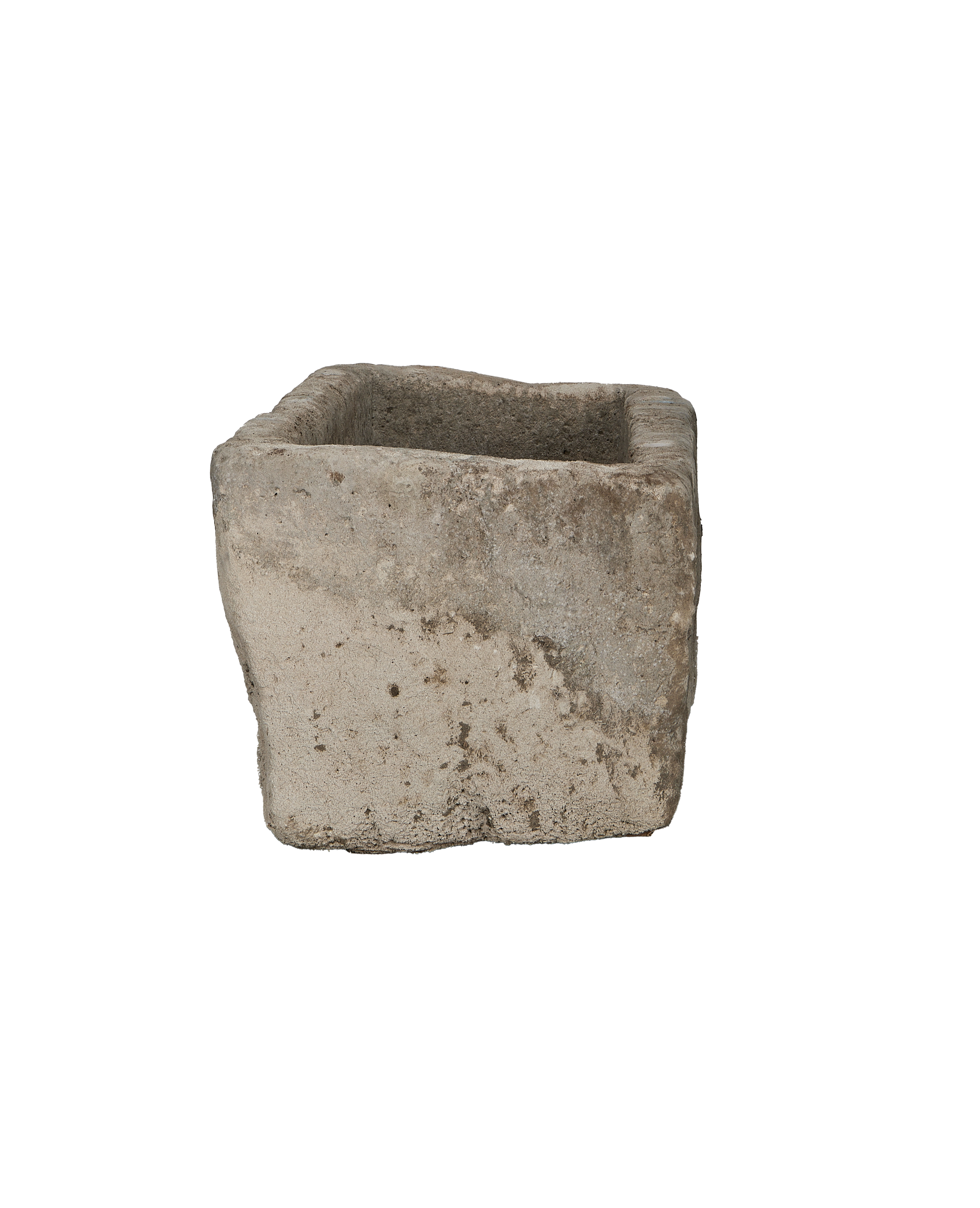 Vintage Indonesian limestone trough viewed from its side, highlighting rough texture and weathered surface.