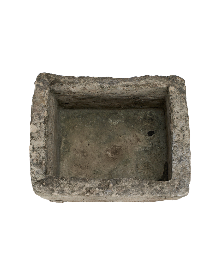Vintage rectangular Indonesian limestone trough, top-down view showing interior depth and rough texture.