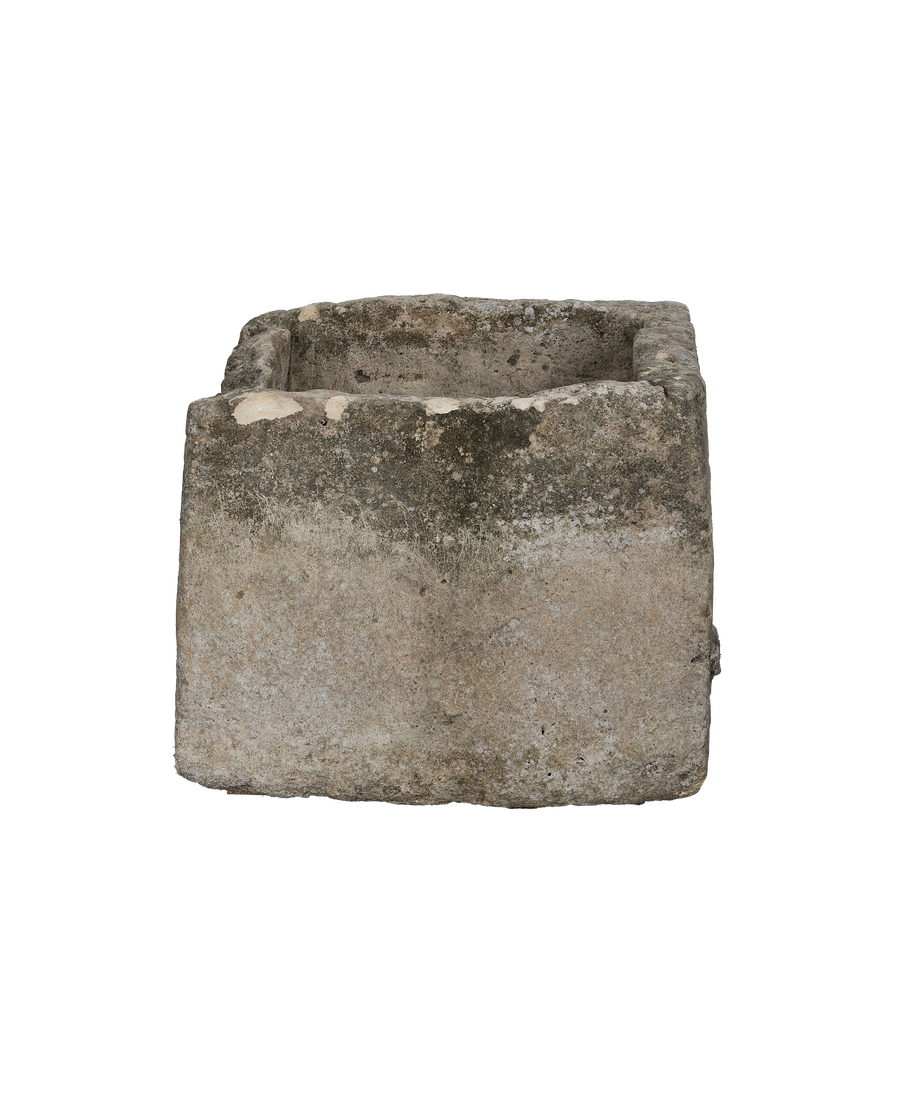 Rectangular vintage Indonesian limestone trough, showcasing its weathered texture and sturdy, thick wall construction.