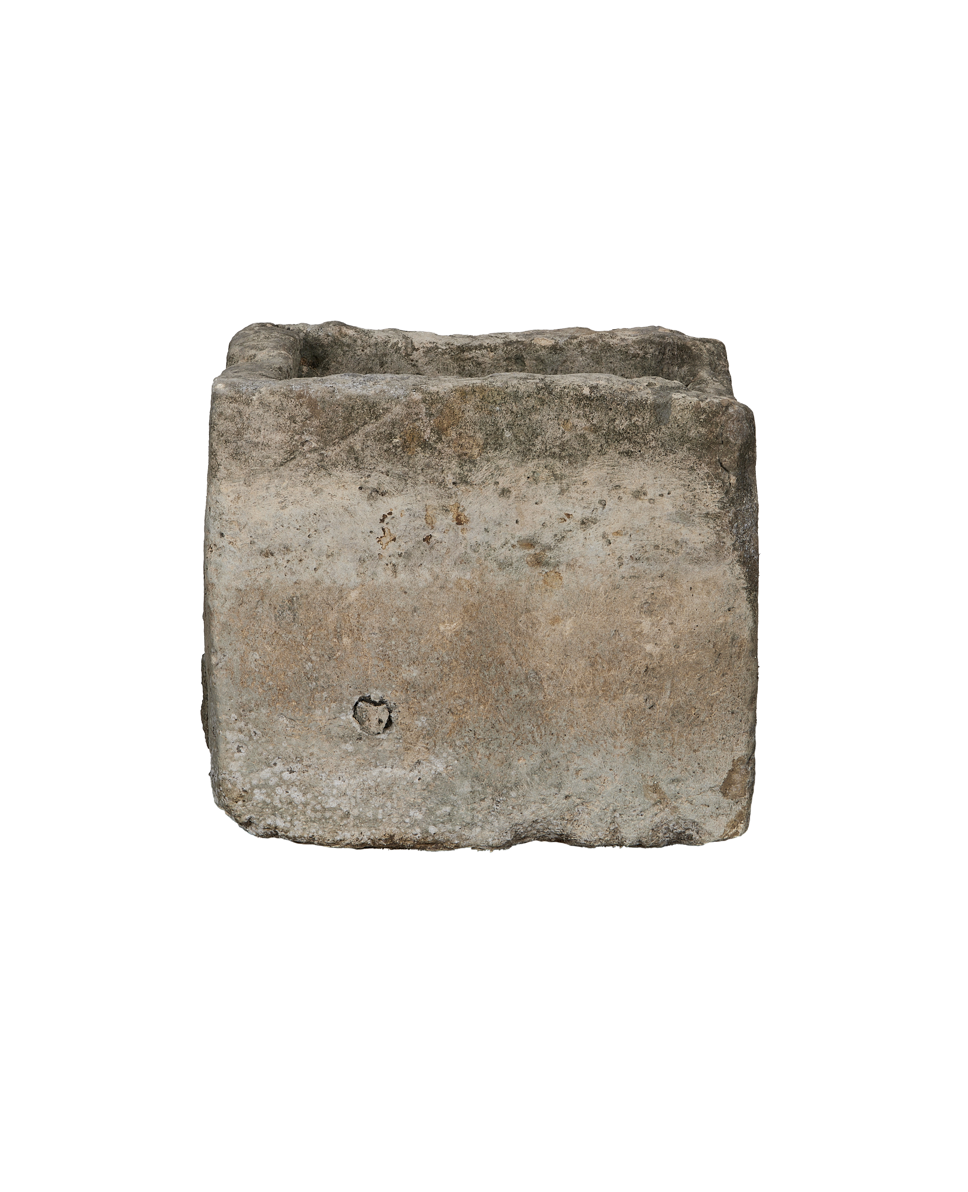 Vintage rectangular limestone trough, side detail showing textured surface and carved hole.