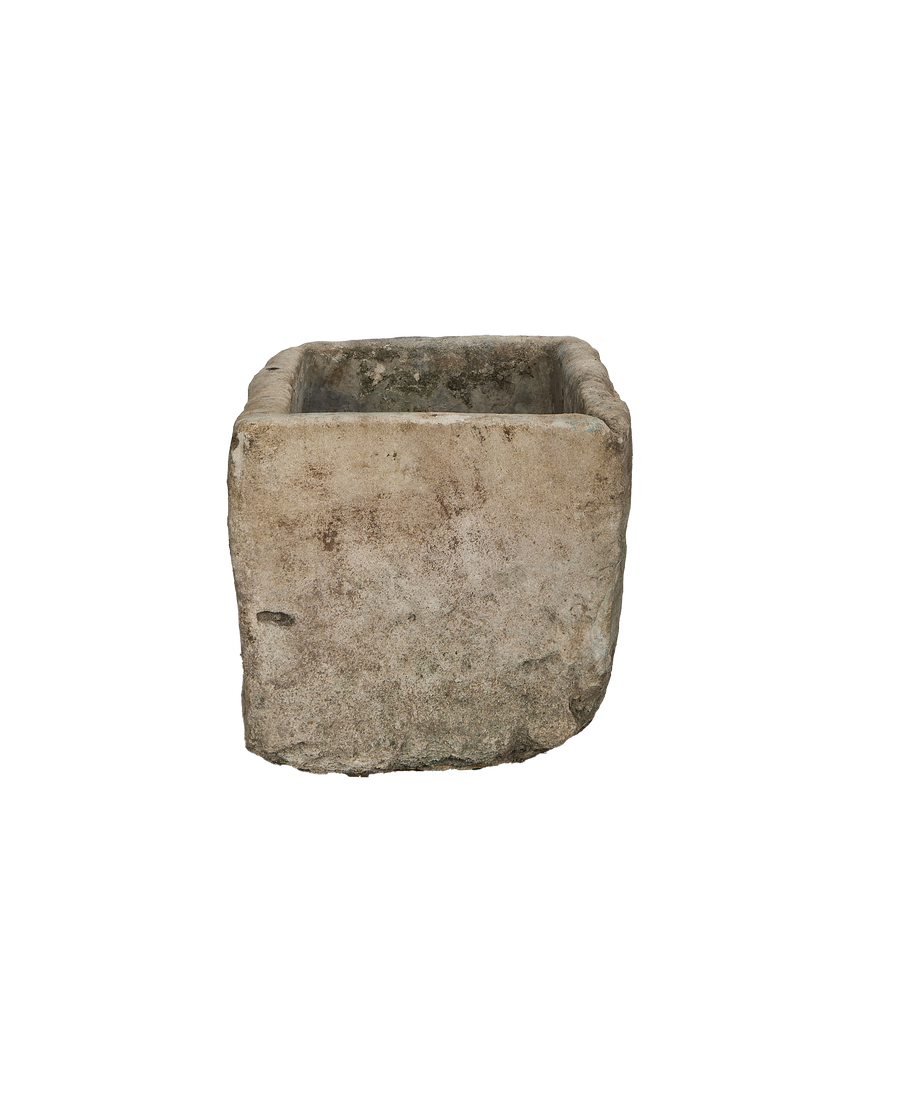 Vintage Indonesian limestone trough, square shape, showing rough weathered exterior texture.