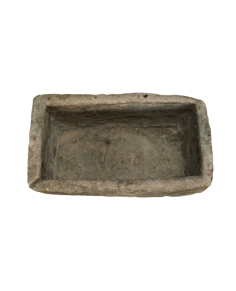 Vintage rectangular limestone trough, overhead view highlighting rustic natural stone texture.