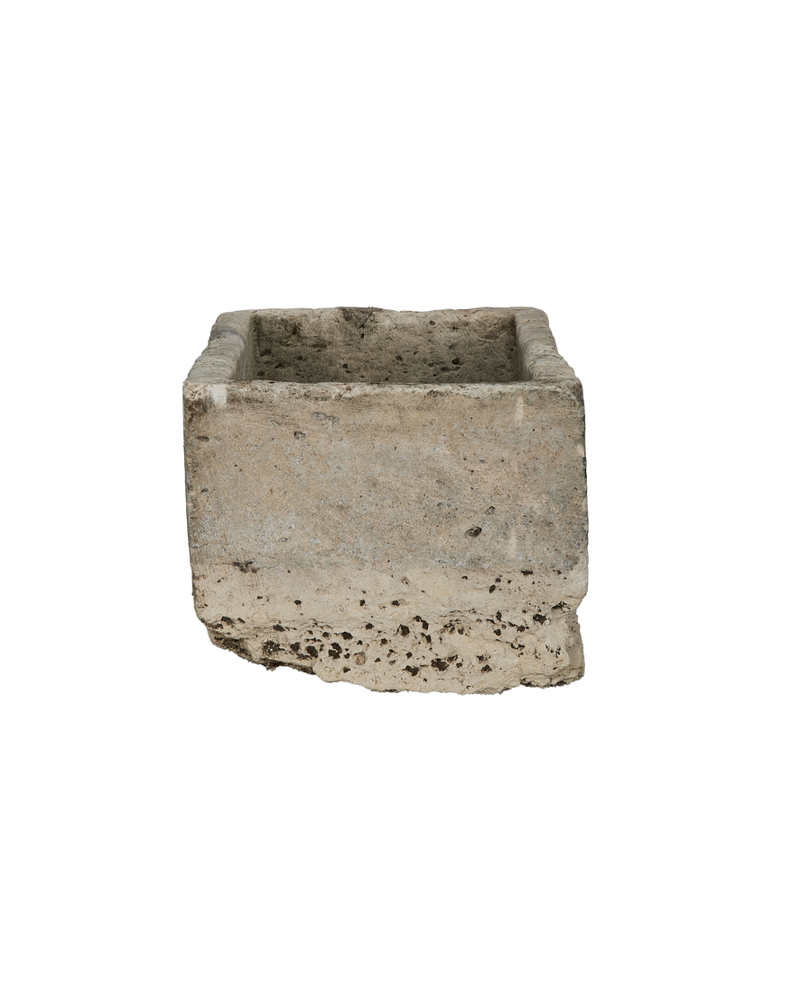 Vintage Indonesian limestone trough, top opening detail, exhibiting weathered texture and imperfections.