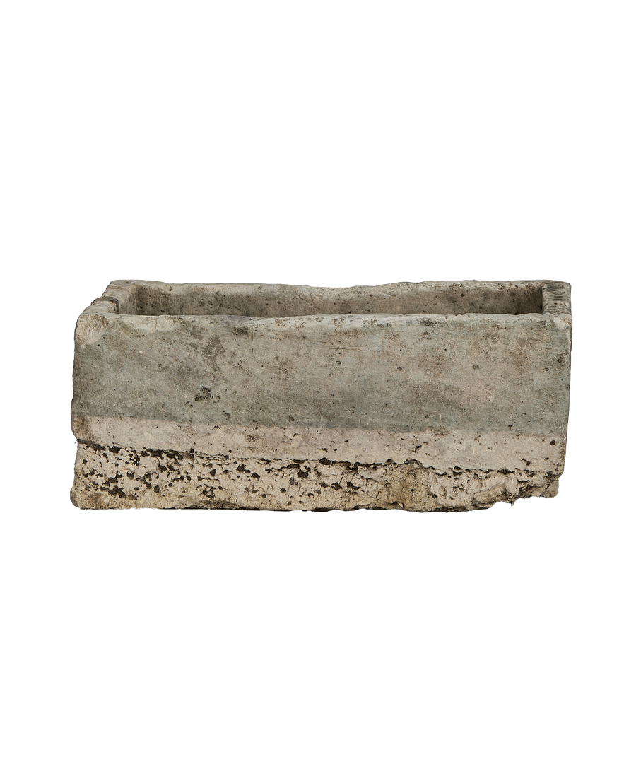 Vintage Indonesian rectangular limestone trough showing rough textured bottom edge.