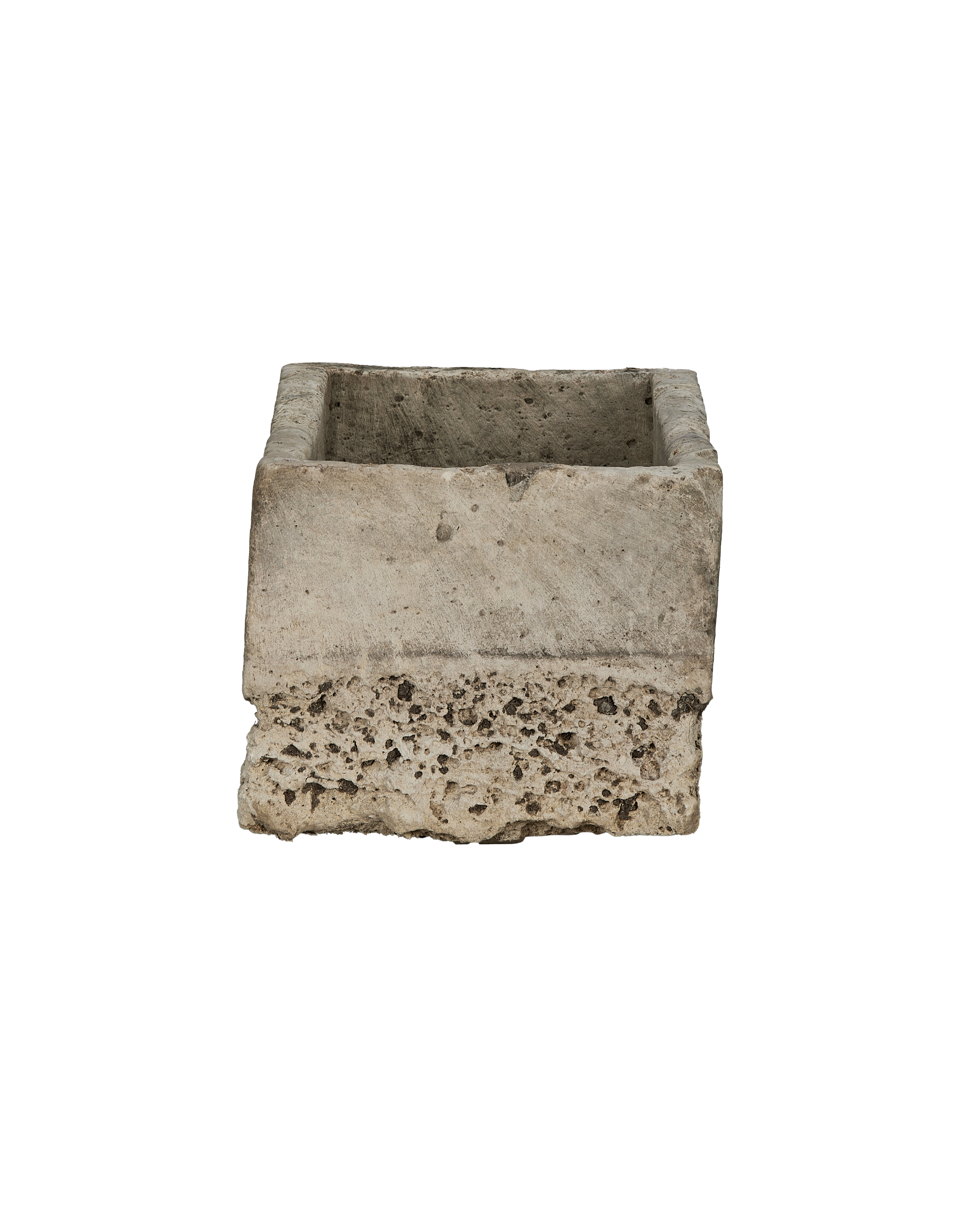 Vintage Indonesian limestone trough, detailed view of rough, weathered porosity at bottom edge.