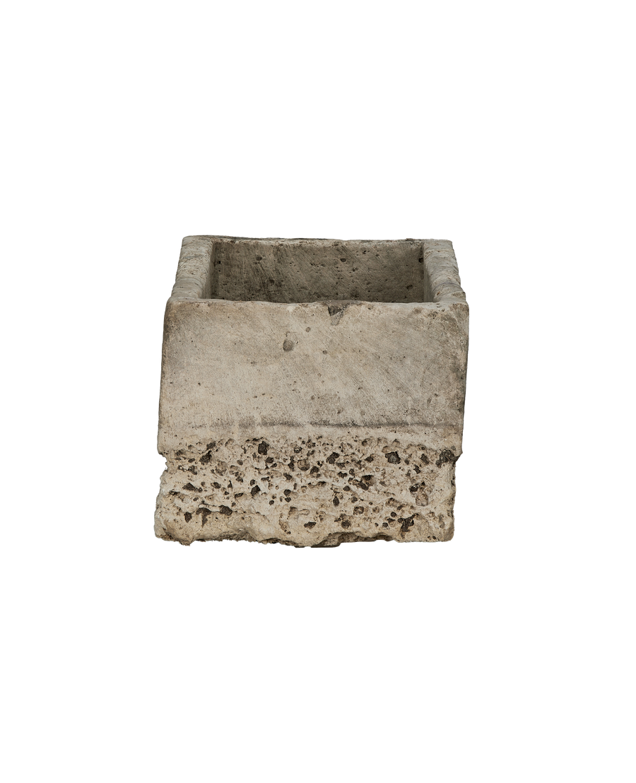 Vintage Indonesian limestone trough, detailed view of rough, weathered porosity at bottom edge.