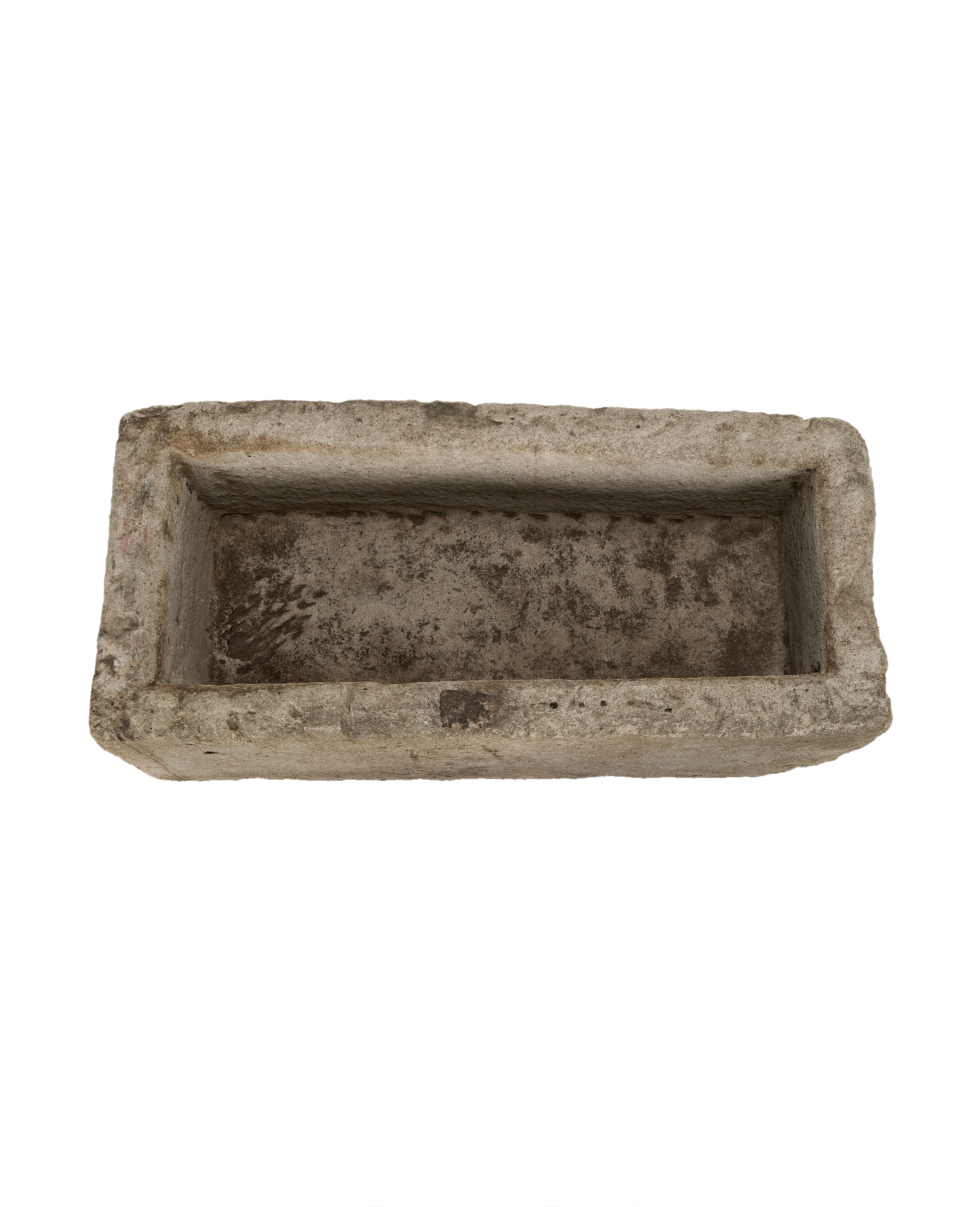 Vintage Indonesian limestone trough, rectangular, top-down view showing weathered, textured interior.
