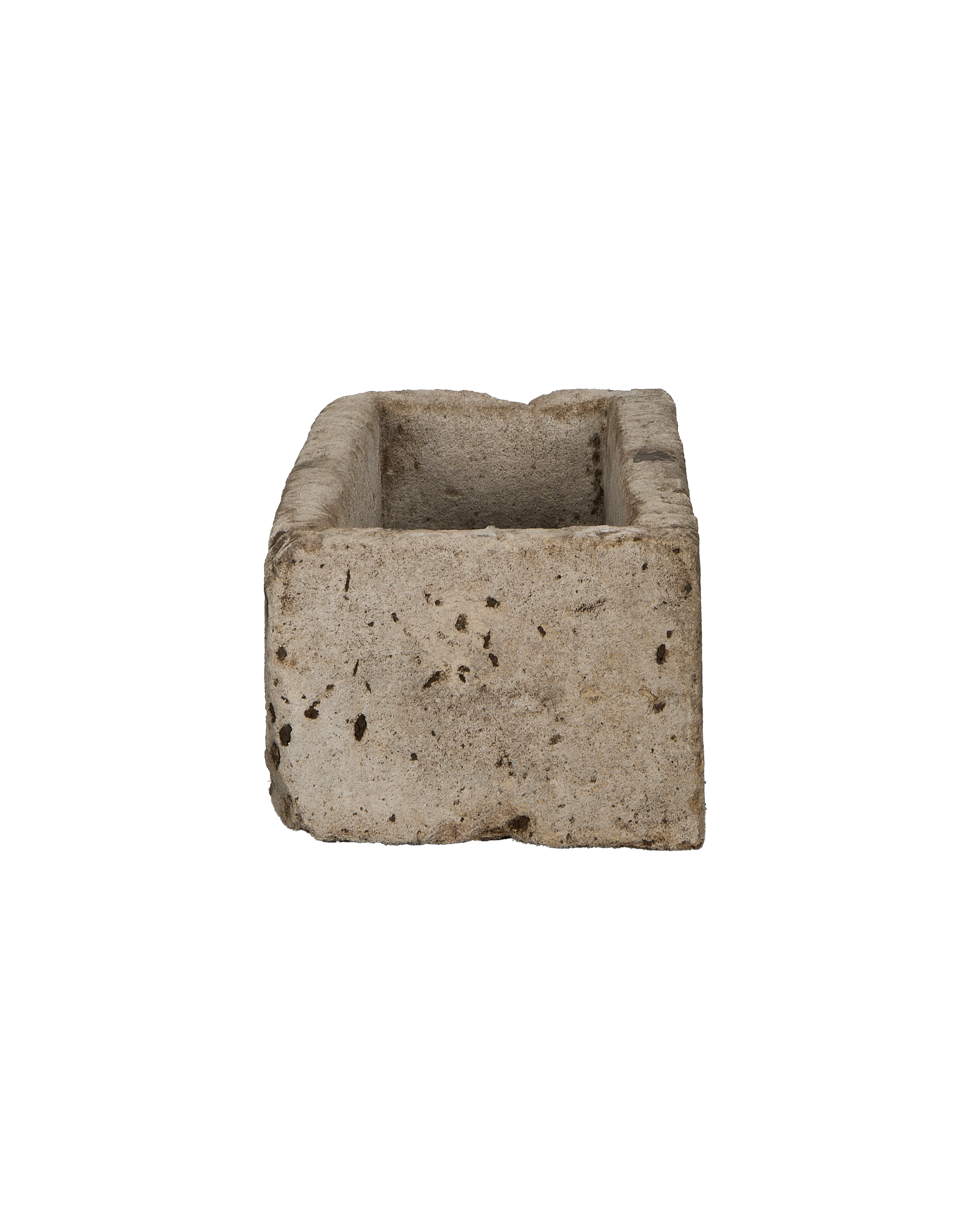Vintage Indonesian limestone rectangular trough, showing rough textured exterior and interior.