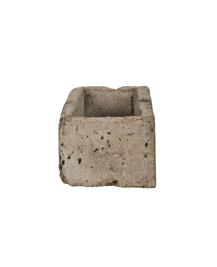 Vintage Indonesian limestone rectangular trough, showing rough textured exterior and interior.