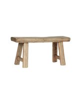 low wooden bench or log with simple structure
