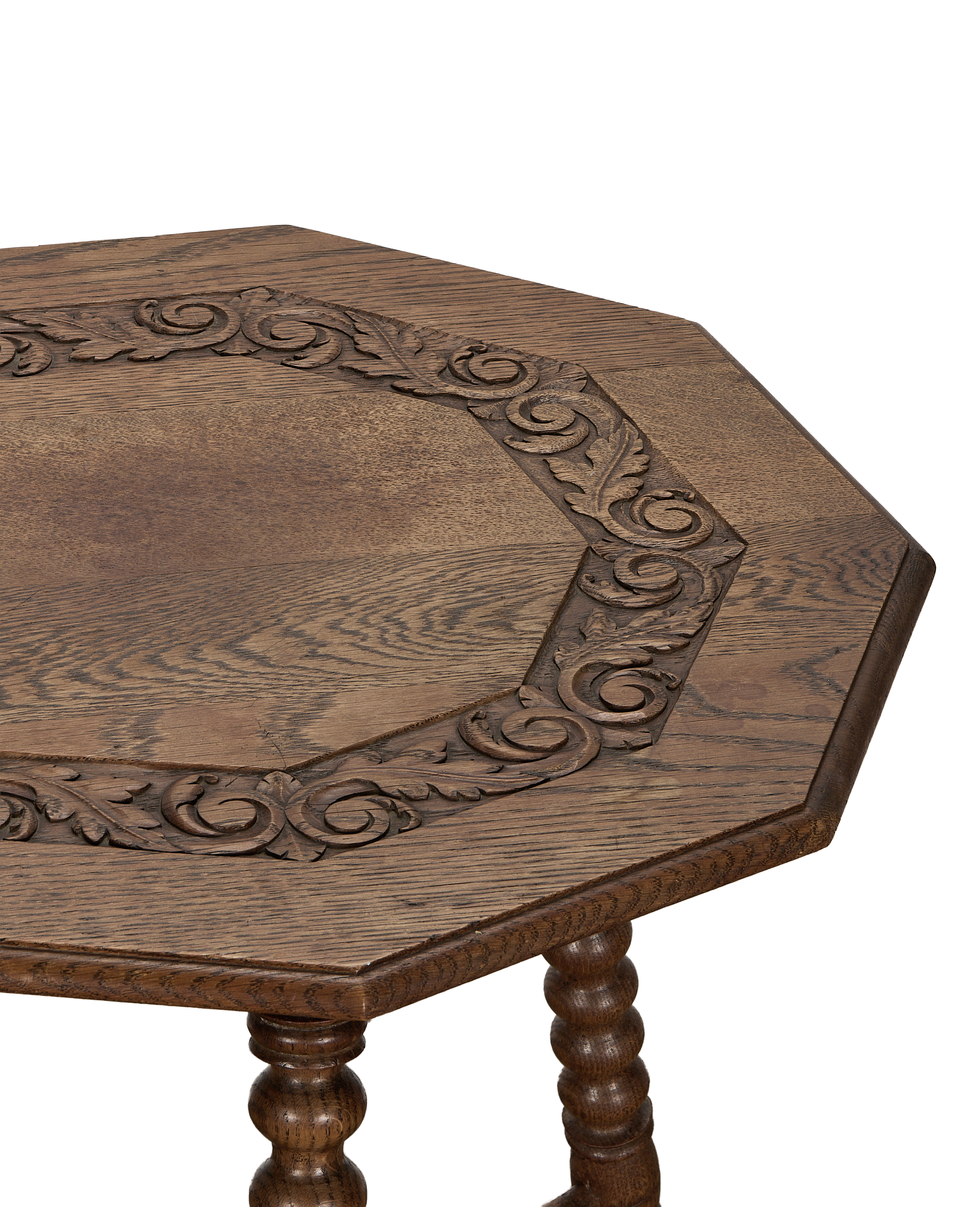 Vintage French oak bobbin table, detailed carved leaf and scroll design on tabletop edge.