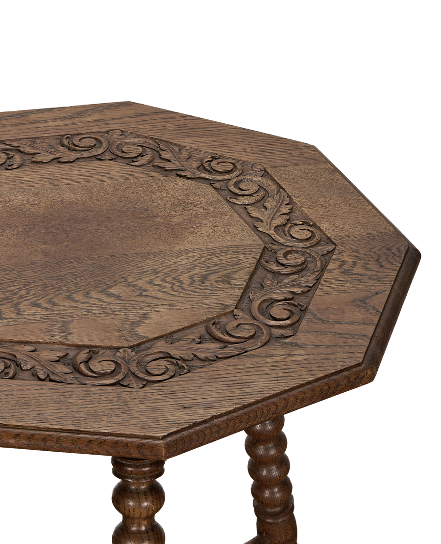 Vintage French oak bobbin table, detailed carved leaf and scroll design on tabletop edge.